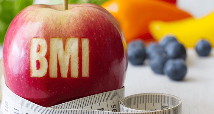 BMIと書かれたリンゴとメジャーの画像
